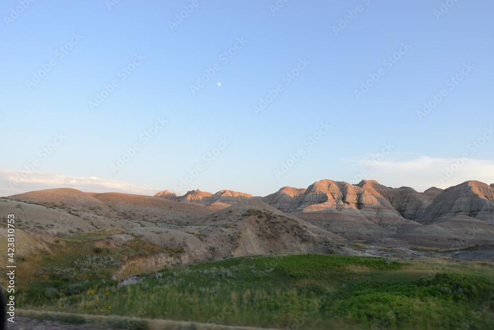 Landscape view of the unusual rock formations at Badlands National Park in South Dakota at sunset Landscape view of the unusual rock formations at Badlands National Park in South Dakota at sunset