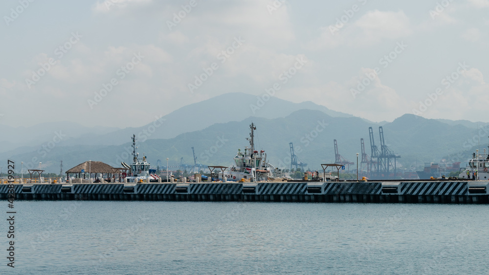 Peaceful view of a port with mountains in the distance