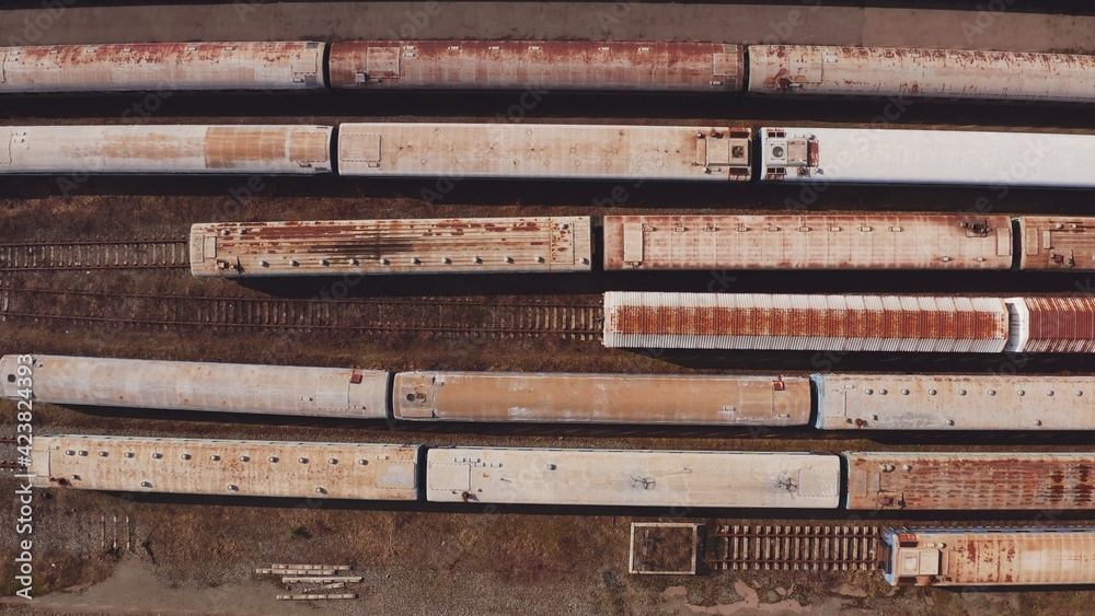 Railway hub showing passenger old crusty trains on tracks next to each other top down view drone moving slowly showing railway tracks positioned parallel. Old Railway Carriages and Wagons 4k Railway hub showing passenger old crusty trains on tracks next to each other top down view drone moving slowly showing railway tracks positioned parallel. Old Railway Carriages and Wagons 4k