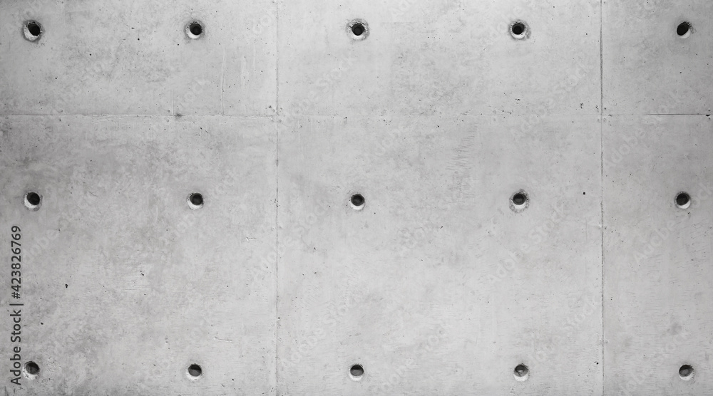 New gray concrete wall with technological holes New gray concrete wall with technological holes