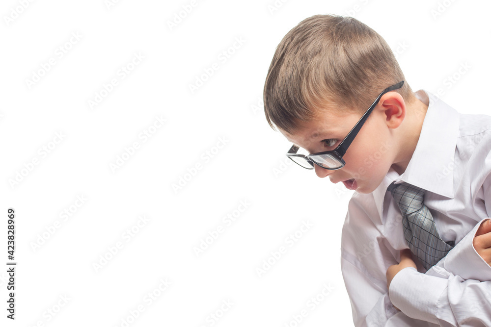 Portrait of a serious schoolboy in businessman suit and glases, isolated on white. Funny child boy in business suit
