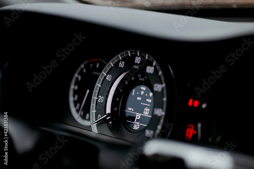 Modern car miles Speedometer close up.