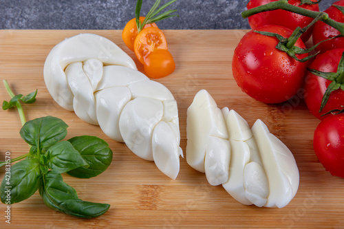 Natural local cheeses. Turkish Knitting, Knitted Cheese on Wooden Board. photo