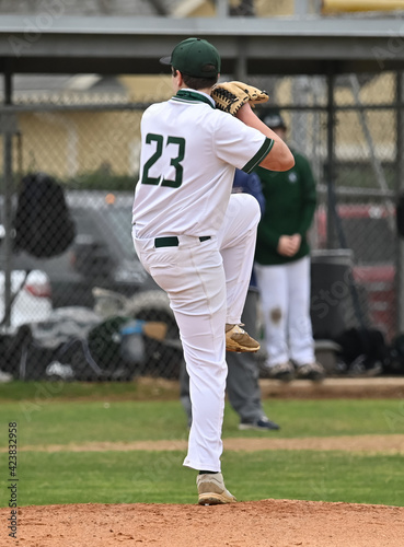 Action photo of high school baseball players making amazing plays during a baseball game