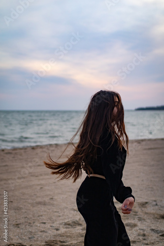 girl dancing on the beach © Inna Litvinenko