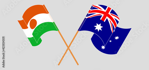Crossed and waving flags of Niger and Australia