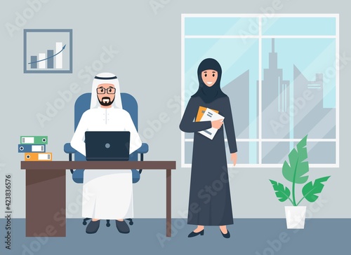 Arab business man and woman working in office.