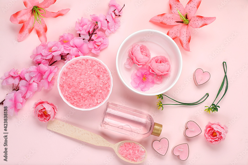 Spa and wellness composition with aromatic rose water, salt, roses and sakura, towels, aromatherapy and skin care, lifestyle concept, invitation and advertising card, selective focus Spa and wellness composition with aromatic rose water, salt, roses and sakura, towels, aromatherapy and skin care, lifestyle concept, invitation and advertising card, selective focus