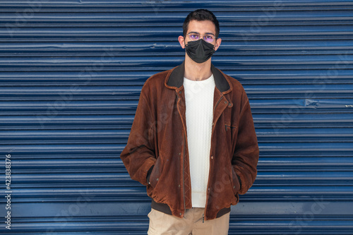 young man with mask on the street