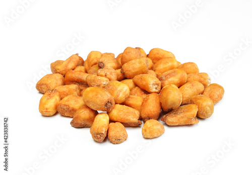 Pile of roasted corn seeds isolated on white background. Crunchy and salty snack