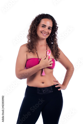 Smiling positive young woman with tube pink top