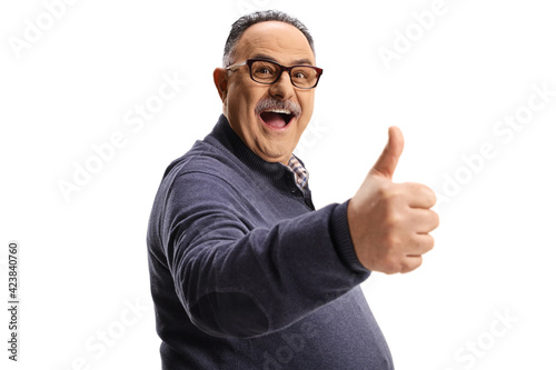 Happy and excited mature man gesturing a thumb up sign