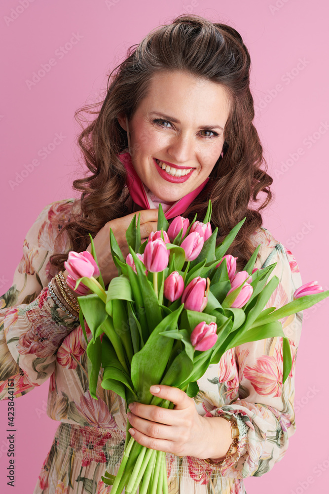 modern woman in floral dress on pink modern woman in floral dress on pink