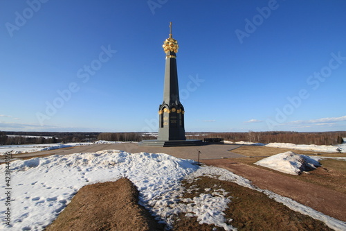 Borodino area and the main monument to Russian soldiers - heroes of the Borodino battle, Borodino, Russia. Aerial. Spring sunny day. Snow in the fields photo