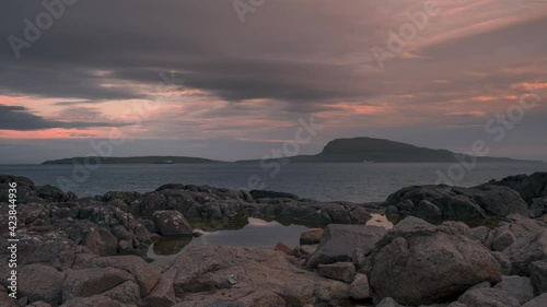 Time lapse of sunset at coast of Streymoy near Torshavn with ships and island Nolsoy, moving boats and clouds, Faroe Islands
 photo