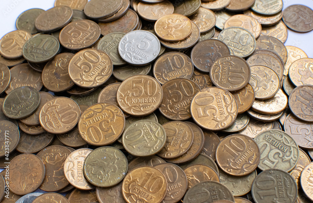 Small Russian coins close-up. Used coins. View from above. Coins in denominations of five, ten, fifty kopecks. Small Russian coins close-up. Used coins. View from above. Coins in denominations of five, ten, fifty kopecks.
