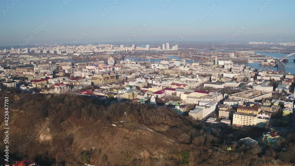 Aerial view of Kiev and landscapes of Dniepr hills, residential neighbourhoods and business districts. Drone shot. Autumn, the fantastic panorama of Kiev, Ukraine. Aerial view of Kiev and landscapes of Dniepr hills, residential neighbourhoods and business districts. Drone shot. Autumn, the fantastic panorama of Kiev, Ukraine.