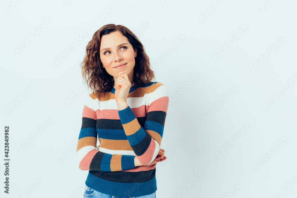 Dreaming happy young woman wearing casual style