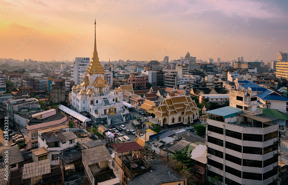 Bangkok, Thailand skyline at Temple of the Golden Buddha, Wat Traimit Temple, at sunset. Travel destination
