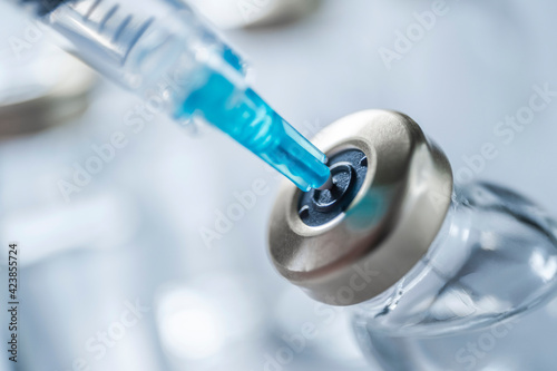 Close-up of Covid-19 vaccine and syringe