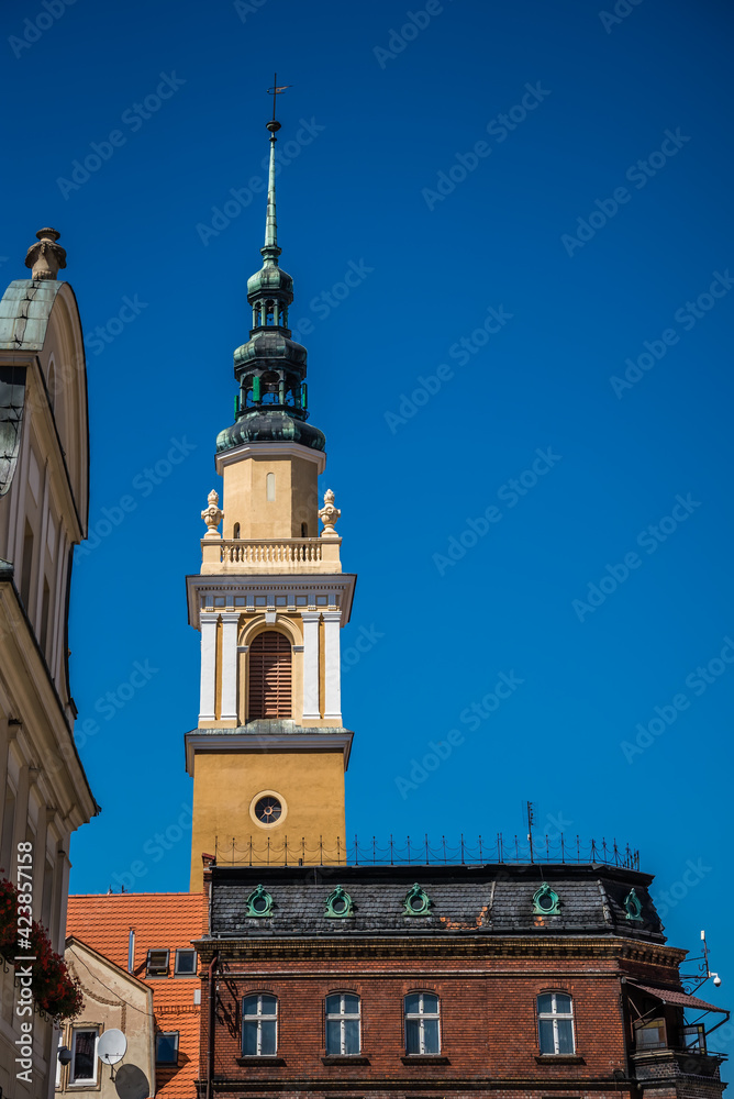 Vertical shot of an ancient church tower in Poland