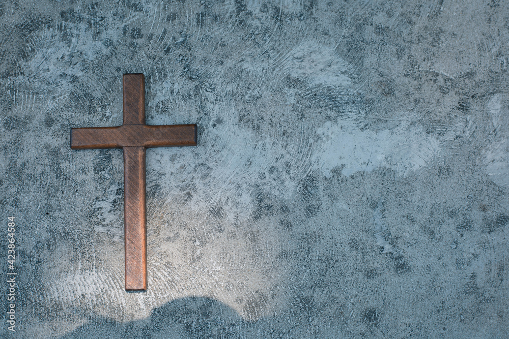 Wooden cross on the ground. Worship, Easter, sins and prayer concept.