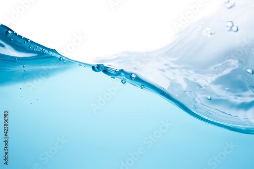 Blurred waves, beautiful swaying, splashing water waves in clean blue water.