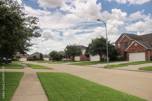 American suburbs. Random street in the neighborhood on a cloudy day.