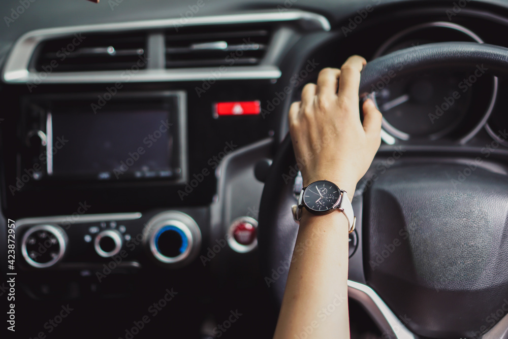 Hand of people on a car steer Hand of people on a car steer
