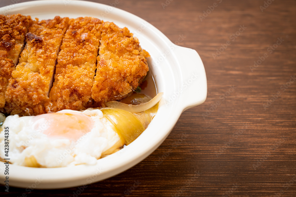 Japanese fried pork cutlet (katsudon) with onion soup and egg Japanese fried pork cutlet (katsudon) with onion soup and egg