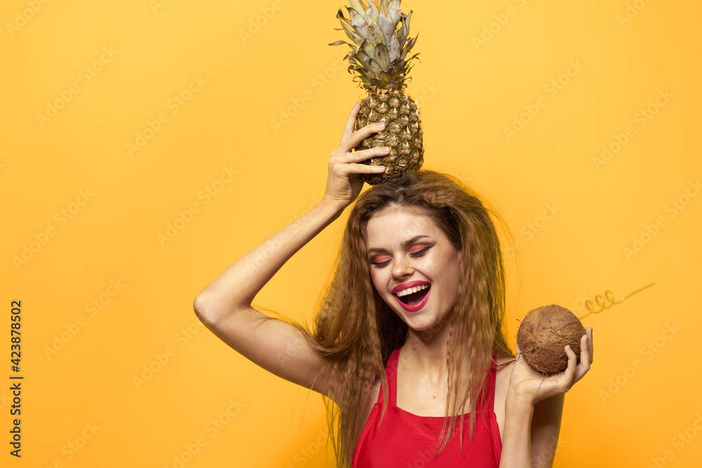woman with pineapple and coconut cocktail exotic fruits summer lifestyle yellow background woman with pineapple and coconut cocktail exotic fruits summer lifestyle yellow background