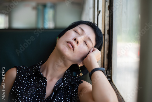 Fotografie woman sleep in the train carriage