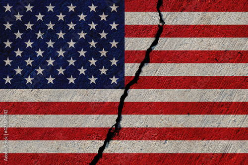united states flag painted on cracked concrete wall