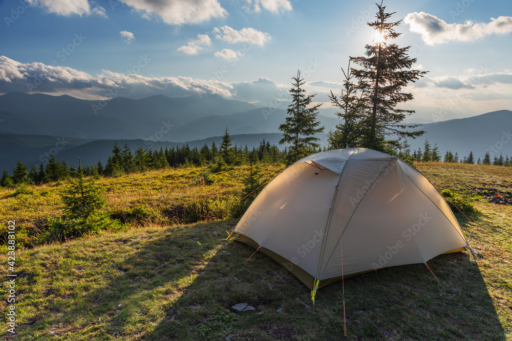 Summer vacation in the mountains with a tourist tent with beautiful views around