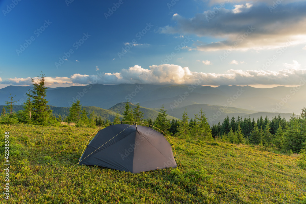 Summer vacation in the mountains with a tourist tent with beautiful views around