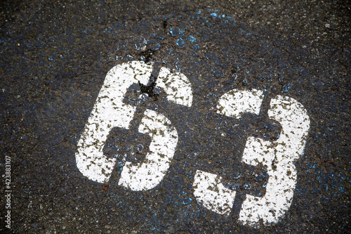 number 63 on asphalt
