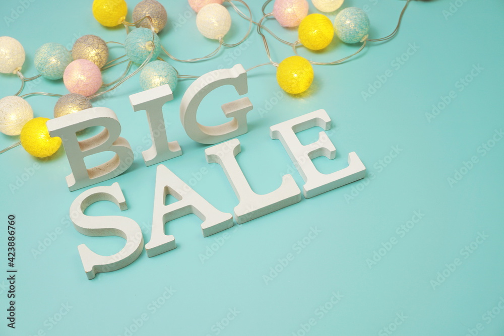 Fototapeta premium Big Sale alphabet letters with LED cotton balls decoration on blue background