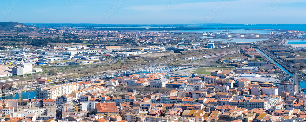Sète in France, aerial panorama, the harbor and the city with typical tiles roofs
