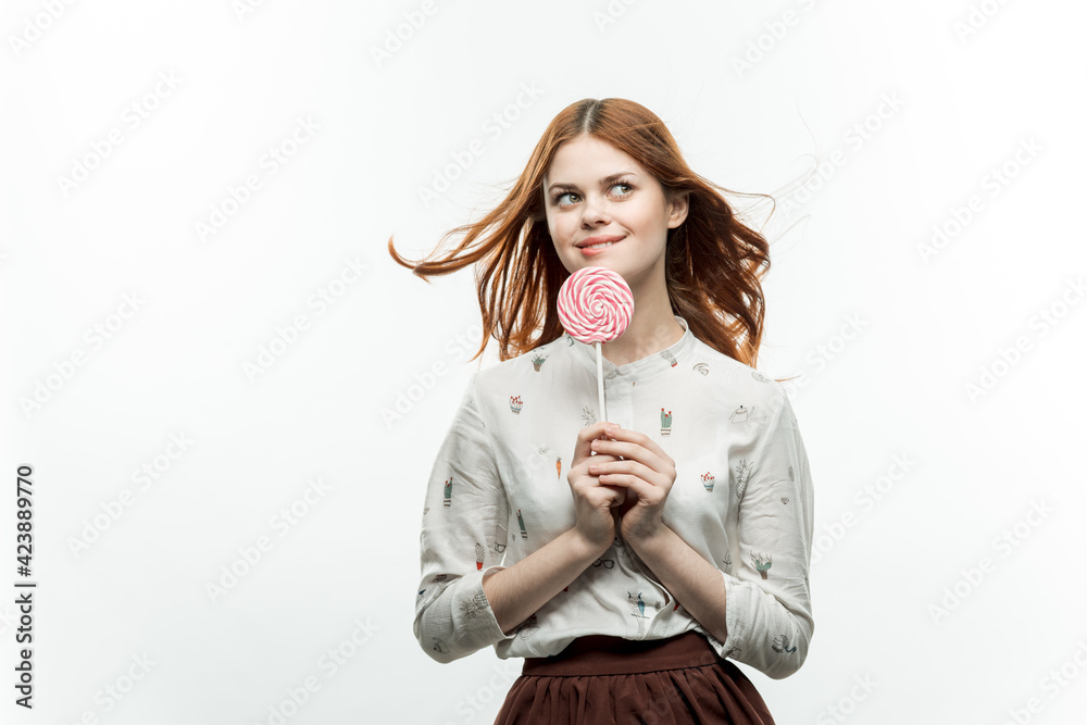 pretty woman with round lollipop near face fun sweets pretty woman with round lollipop near face fun sweets