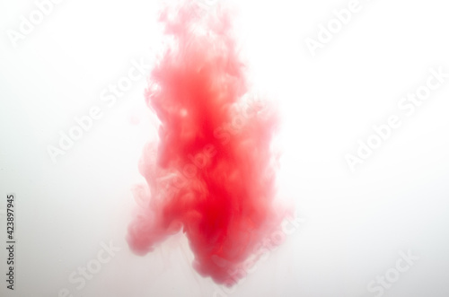 Acrylic red colors in water. Abstract background. Abstract paints.