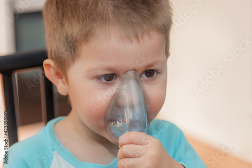 Fotografía Little boy using nebulizer during inhaling therapy