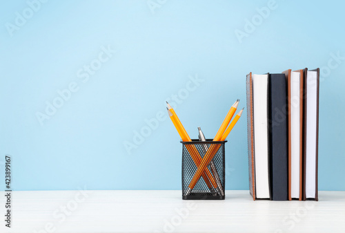 Studio workspace with notepads and office supplies photo