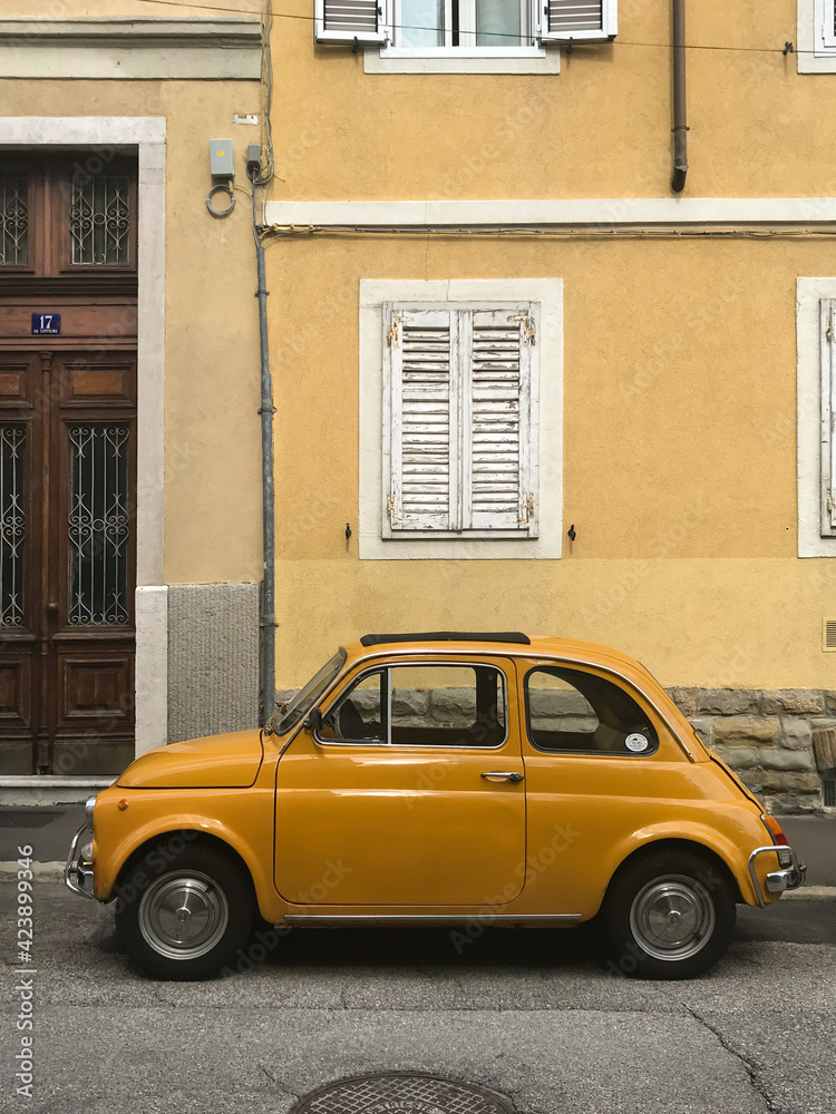 An old Fiat 500 car on the streets of Trieste, Italy