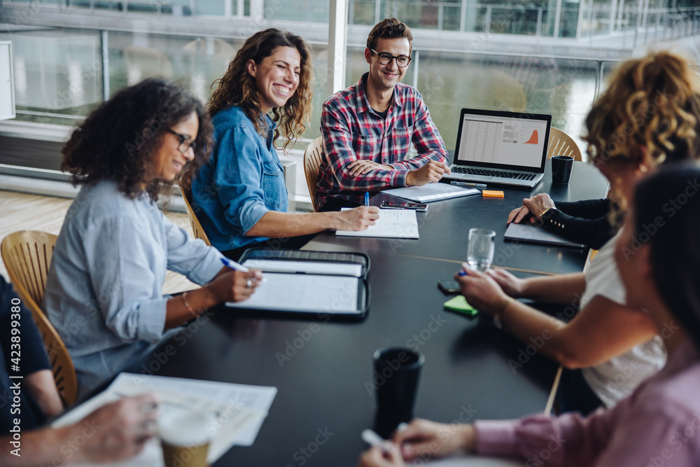 © Jacob Lund - Diverse group of business team in boardroom meeting
