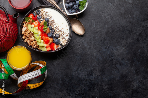 Healthy breakfast with bowl of granola, yogurt and fresh berries