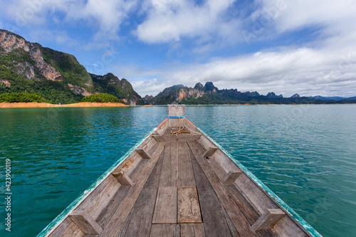 raditional longtail boat with beautiful scenery view in Ratchaprapha Dam at Khao Sok National Park