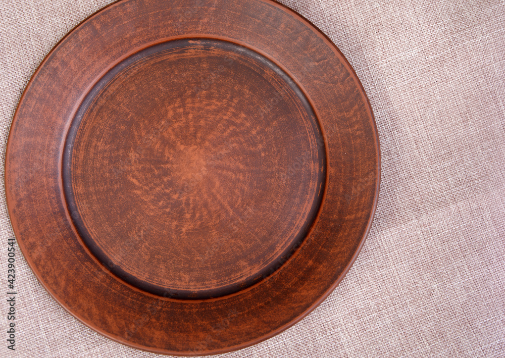 Beautiful ceramic plates on a linen tablecloth. Beautiful ceramic plates on a linen tablecloth.