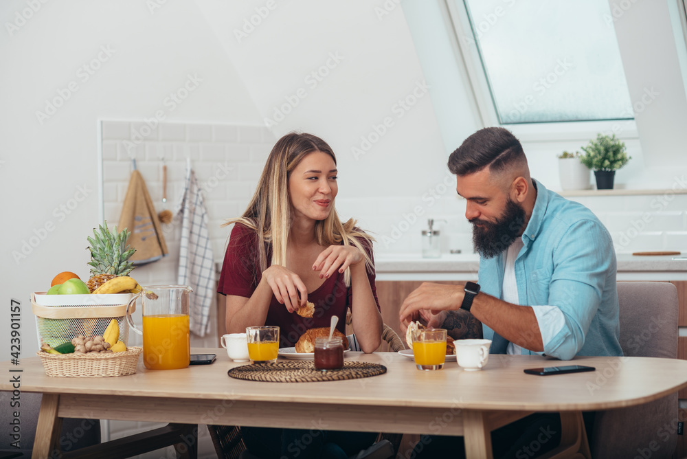 Couple having breakfast at home