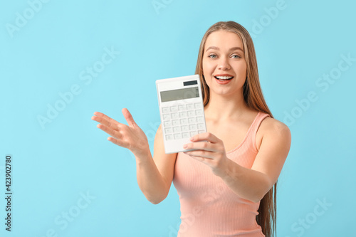 Young woman with calculator...