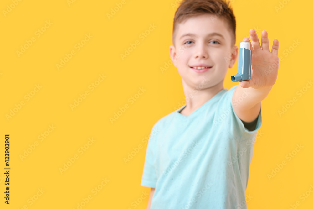 Little boy with inhaler on color background Little boy with inhaler on color background